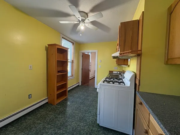 a kitchen with a stove and a refrigerator
