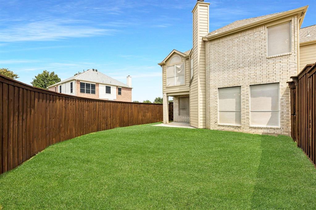 6439 Chester Drive Frisco, TX 75035 - Photo 11 of 12 a view of a backyard with a garden