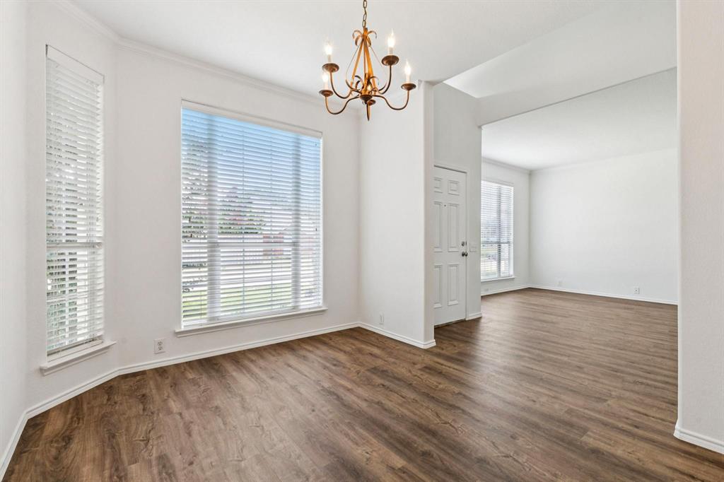 6439 Chester Drive Frisco, TX 75035 - Photo 3 of 12 a view of an empty room with a window and wooden floor
