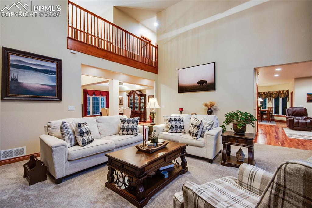 16075 Winding Trail Road Colorado Springs, CO 80908 - Photo 14 of 42 a living room with furniture and a flat screen tv