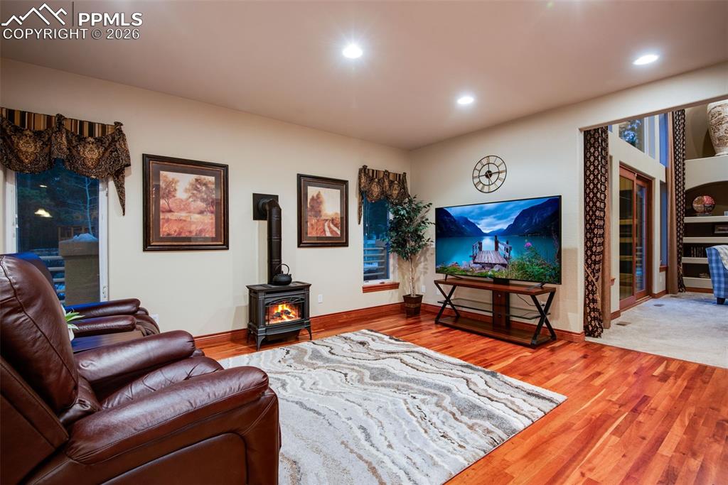 16075 Winding Trail Road Colorado Springs, CO 80908 - Photo 17 of 42 a living room with furniture and a flat screen tv