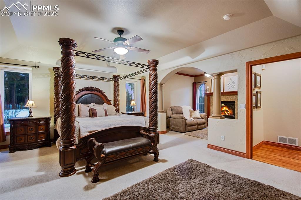 16075 Winding Trail Road Colorado Springs, CO 80908 - Photo 21 of 42 a living room with furniture gym equipment and a rug