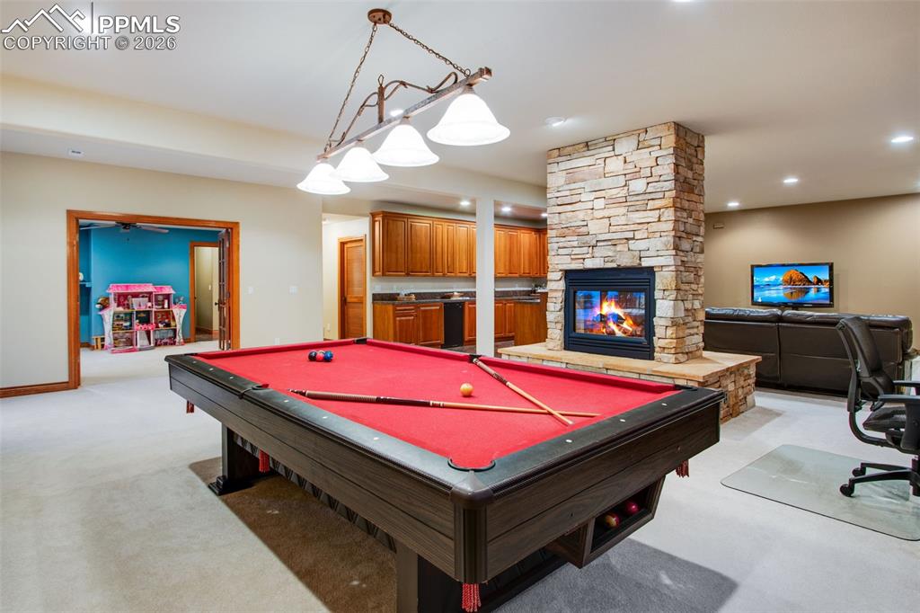 16075 Winding Trail Road Colorado Springs, CO 80908 - Photo 29 of 42 a room with pool table and flat screen tv
