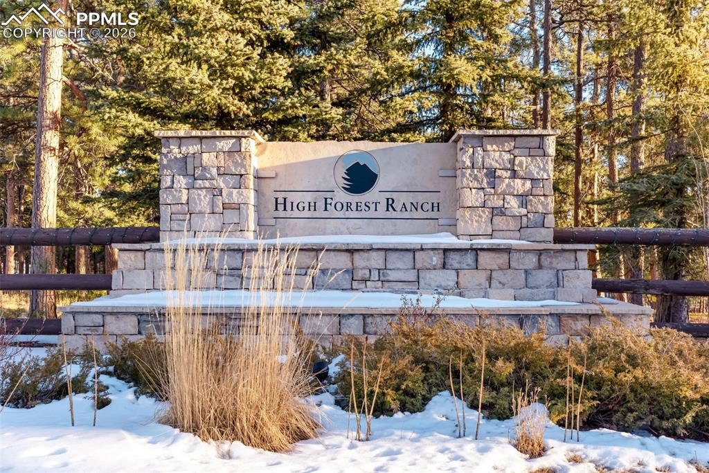 16075 Winding Trail Road Colorado Springs, CO 80908 - Photo 36 of 42 a sign on the side of a building