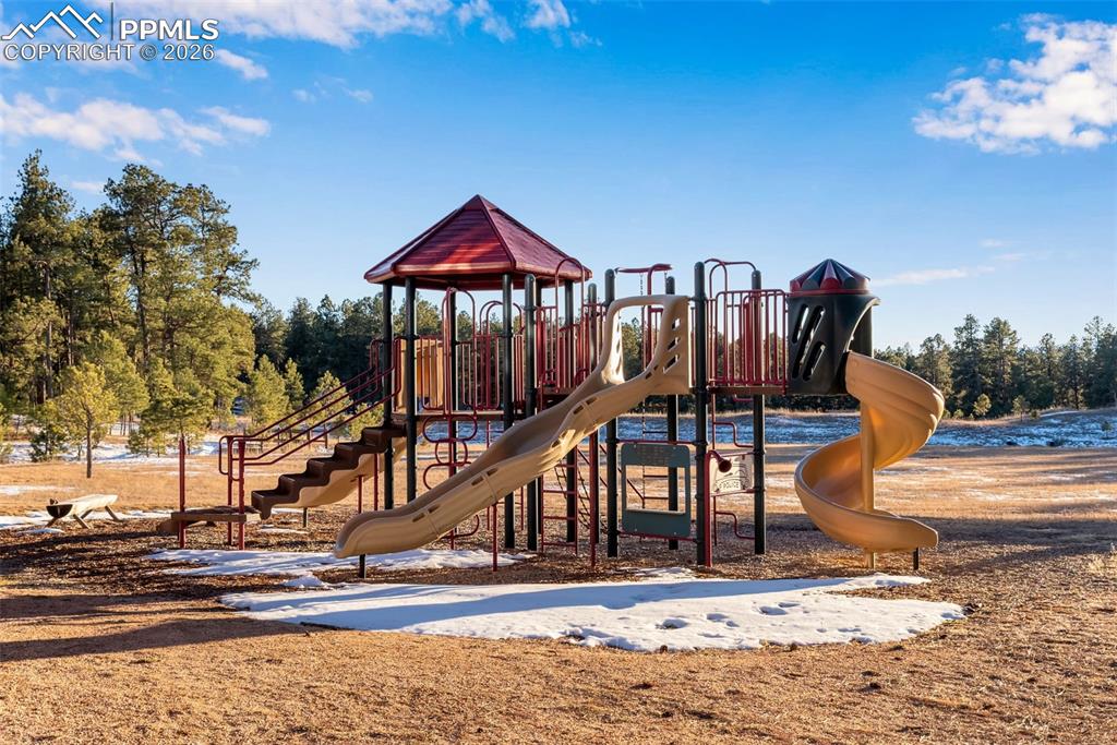 16075 Winding Trail Road Colorado Springs, CO 80908 - Photo 40 of 42 a view of a house with a small yard