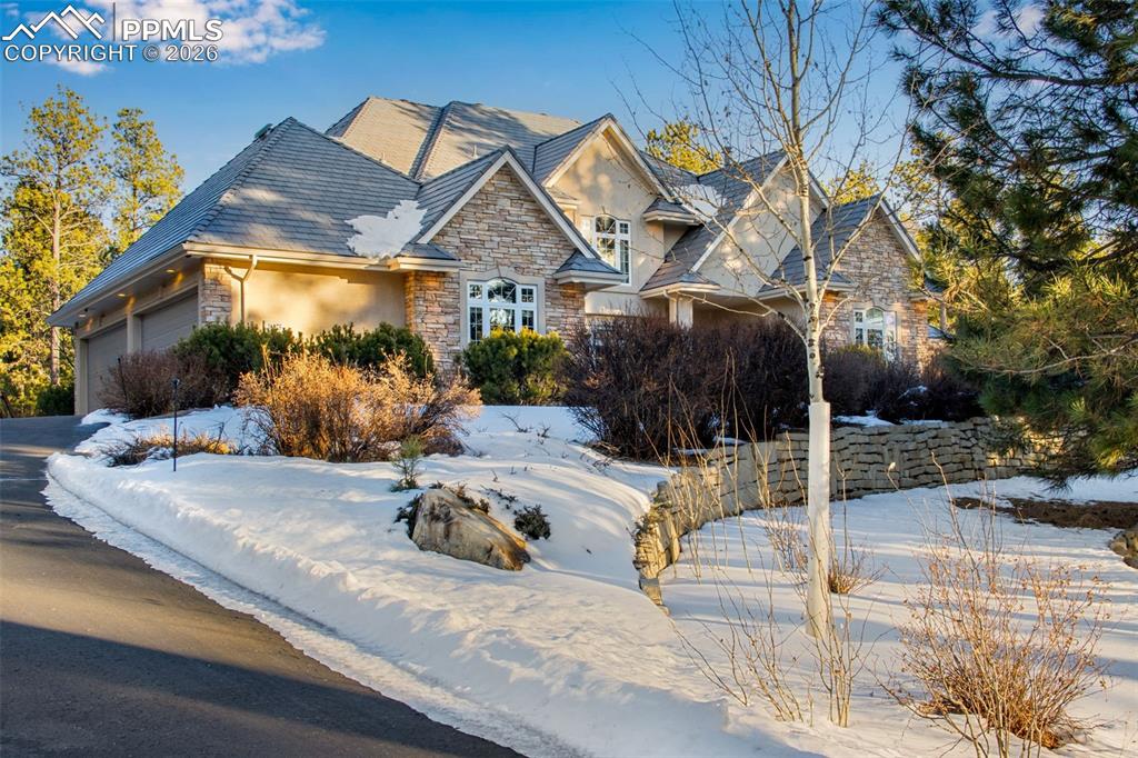 16075 Winding Trail Road Colorado Springs, CO 80908 - Photo 4 of 42 a view of a house with a yard
