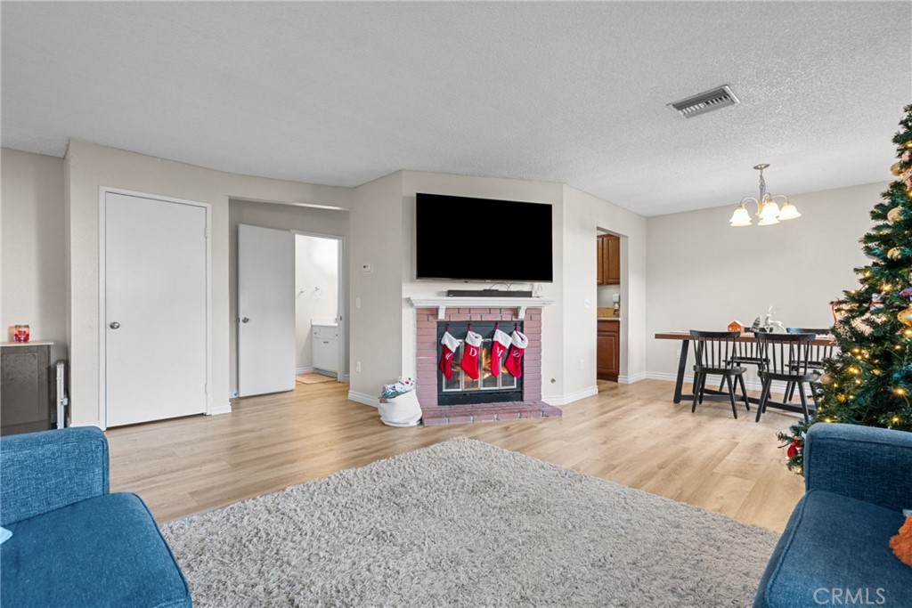 31363 The Old Road, Unit A Castaic, CA 91384 - Photo 12 of 43 a living room with furniture and a flat screen tv