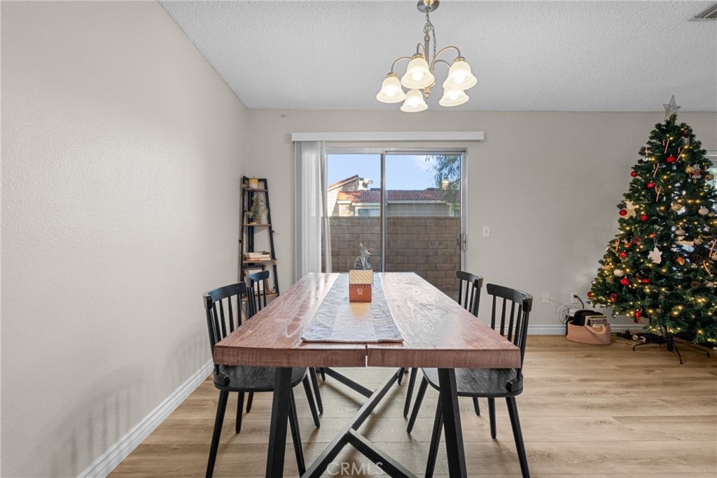 31363 The Old Road, Unit A Castaic, CA 91384 - Photo 14 of 43 a view of a dining room with furniture window and wooden floor
