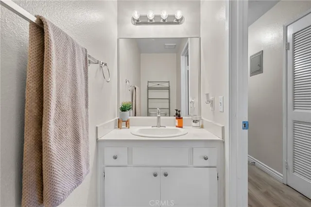 a bathroom with a double vanity sink and mirror