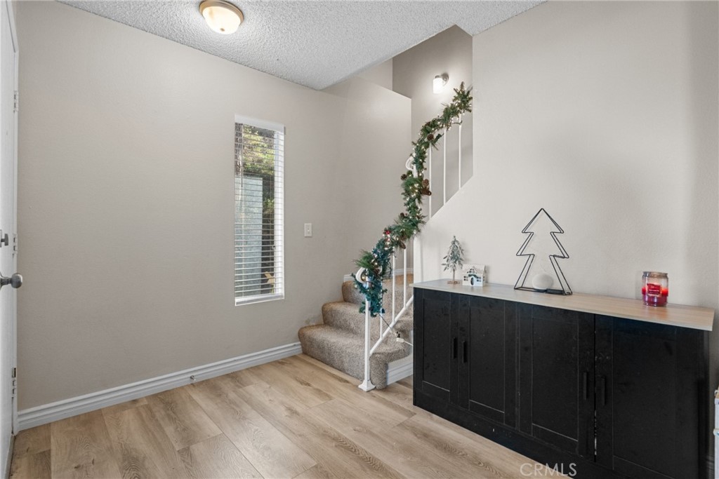 31363 The Old Road, Unit A Castaic, CA 91384 - Photo 22 of 43 a living room with furniture and a chandelier