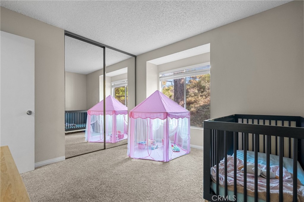 31363 The Old Road, Unit A Castaic, CA 91384 - Photo 26 of 43 a bedroom with a bed and a window