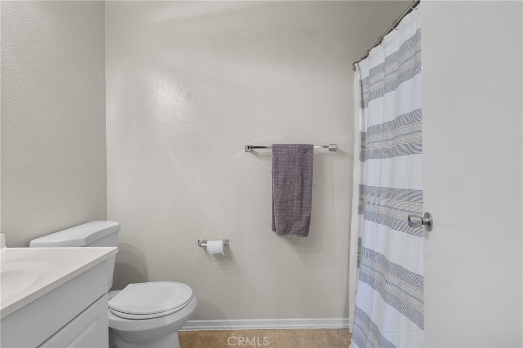 31363 The Old Road, Unit A Castaic, CA 91384 - Photo 27 of 43 a bathroom with a shower toilet and sink