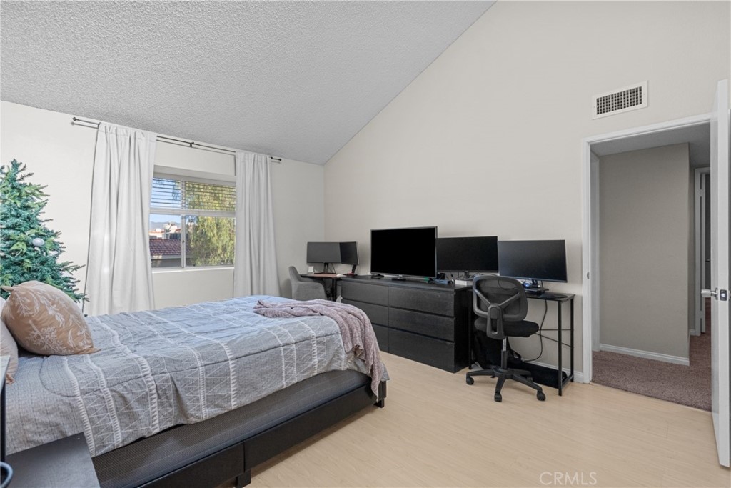 31363 The Old Road, Unit A Castaic, CA 91384 - Photo 31 of 43 a bedroom with a bed and a flat screen tv