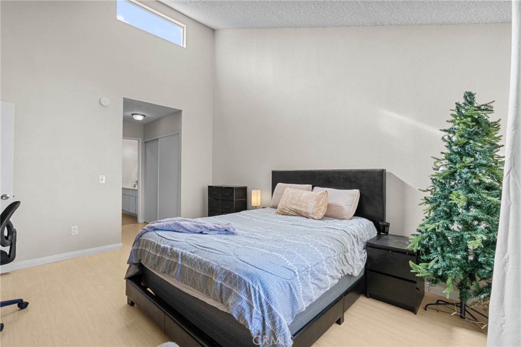 31363 The Old Road, Unit A Castaic, CA 91384 - Photo 32 of 43 a bedroom with a bed and a potted plant