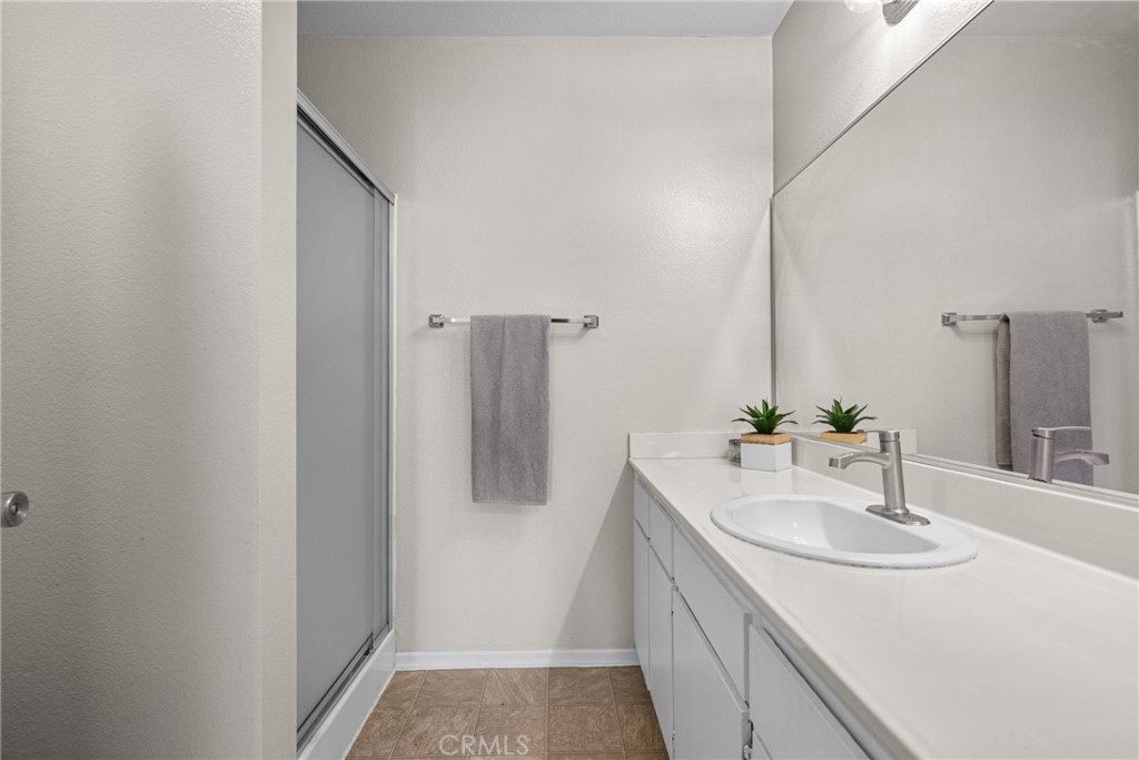 31363 The Old Road, Unit A Castaic, CA 91384 - Photo 34 of 43 a bathroom with a sink and a mirror