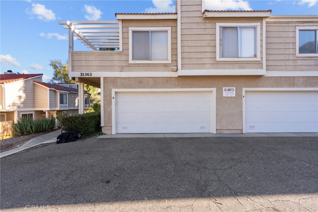 31363 The Old Road, Unit A Castaic, CA 91384 - Photo 4 of 43 a view of a house with a street