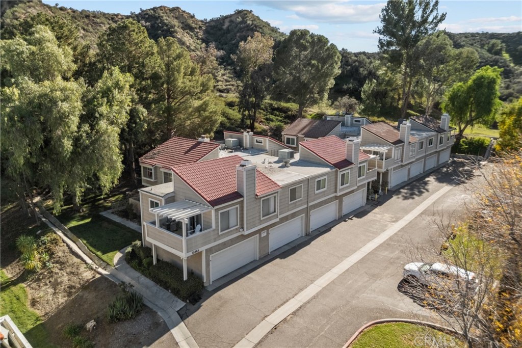 31363 The Old Road, Unit A Castaic, CA 91384 - Photo 42 of 43 an aerial view of a house with swimming pool