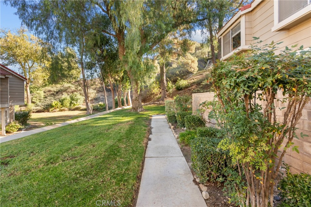 31363 The Old Road, Unit A Castaic, CA 91384 - Photo 5 of 43 a view of a pathway with a yard