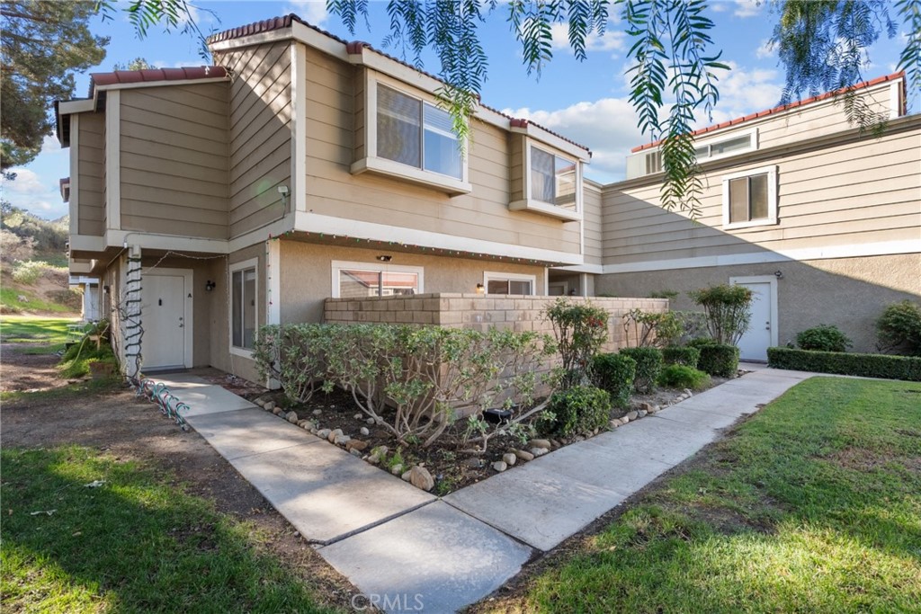 31363 The Old Road, Unit A Castaic, CA 91384 - Photo 6 of 43 a front view of a house with garden