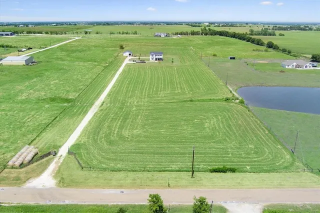 a view of a lake with a big yard