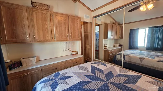 a kitchen with a sink and wooden cabinets