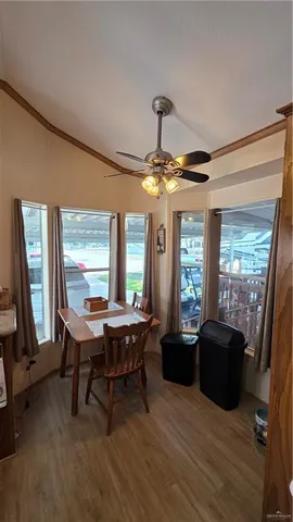 a view of a livingroom with furniture window and wooden floor