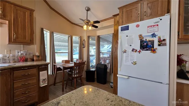 a view of a kitchen with furniture and a window