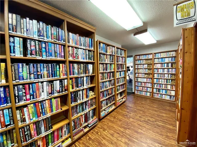 a view of room with furniture and book shelf
