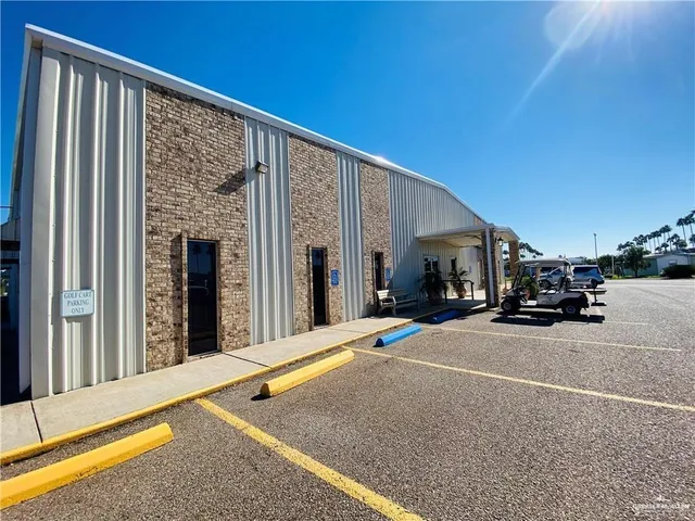 a view of a street with car parked