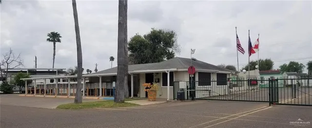 a couple of cars parked in front of a building