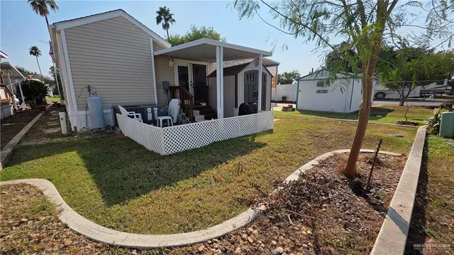 a view of a house with backyard