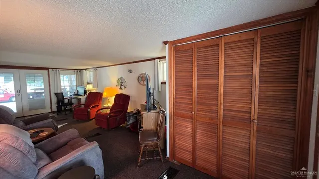 a bed room with a bed and a mirror