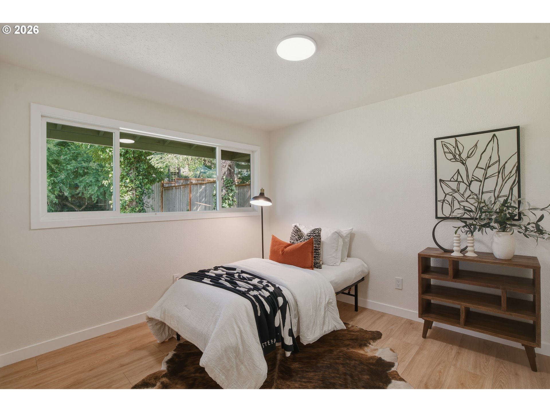 3455 Potter Street Eugene, OR 97405 - Photo 32 of 36 a bedroom with a bed and a window