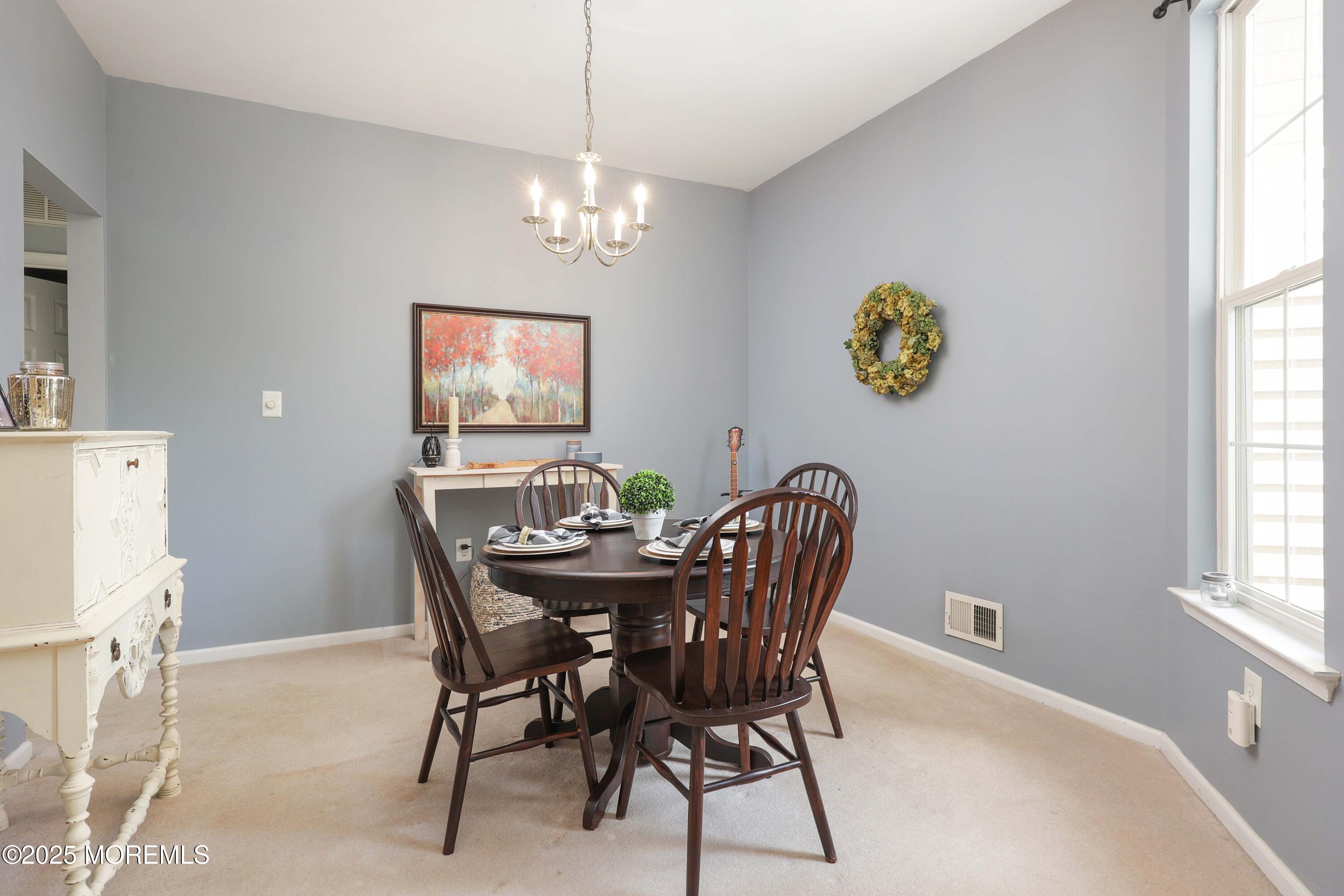 1 Exeter Pass Colts Neck, NJ 07722 - Photo 13 of 42 a view of a dining room with furniture and window