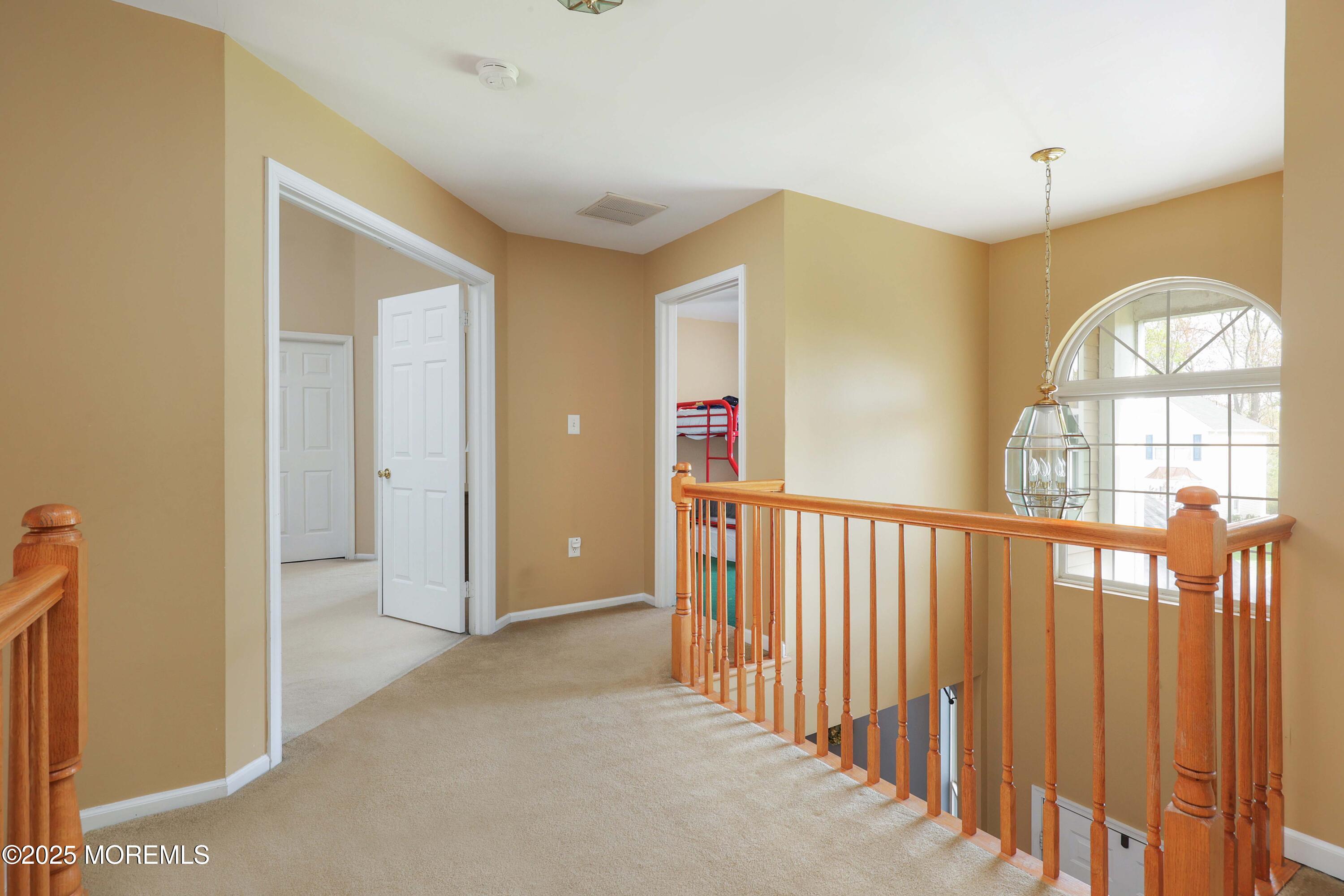 1 Exeter Pass Colts Neck, NJ 07722 - Photo 22 of 42 a view of an entryway with wooden floor