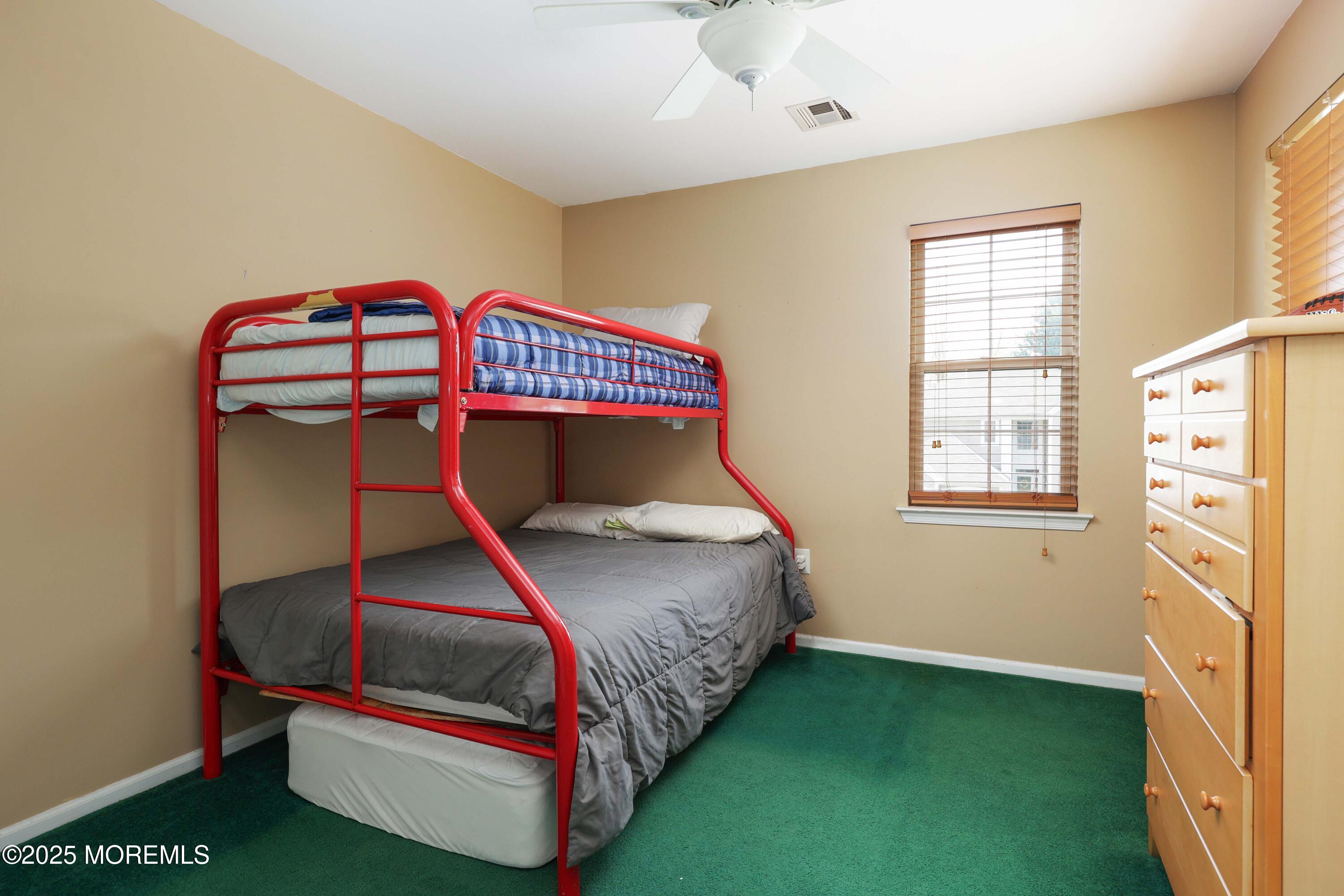 1 Exeter Pass Colts Neck, NJ 07722 - Photo 29 of 42 a bedroom with a bed and a window