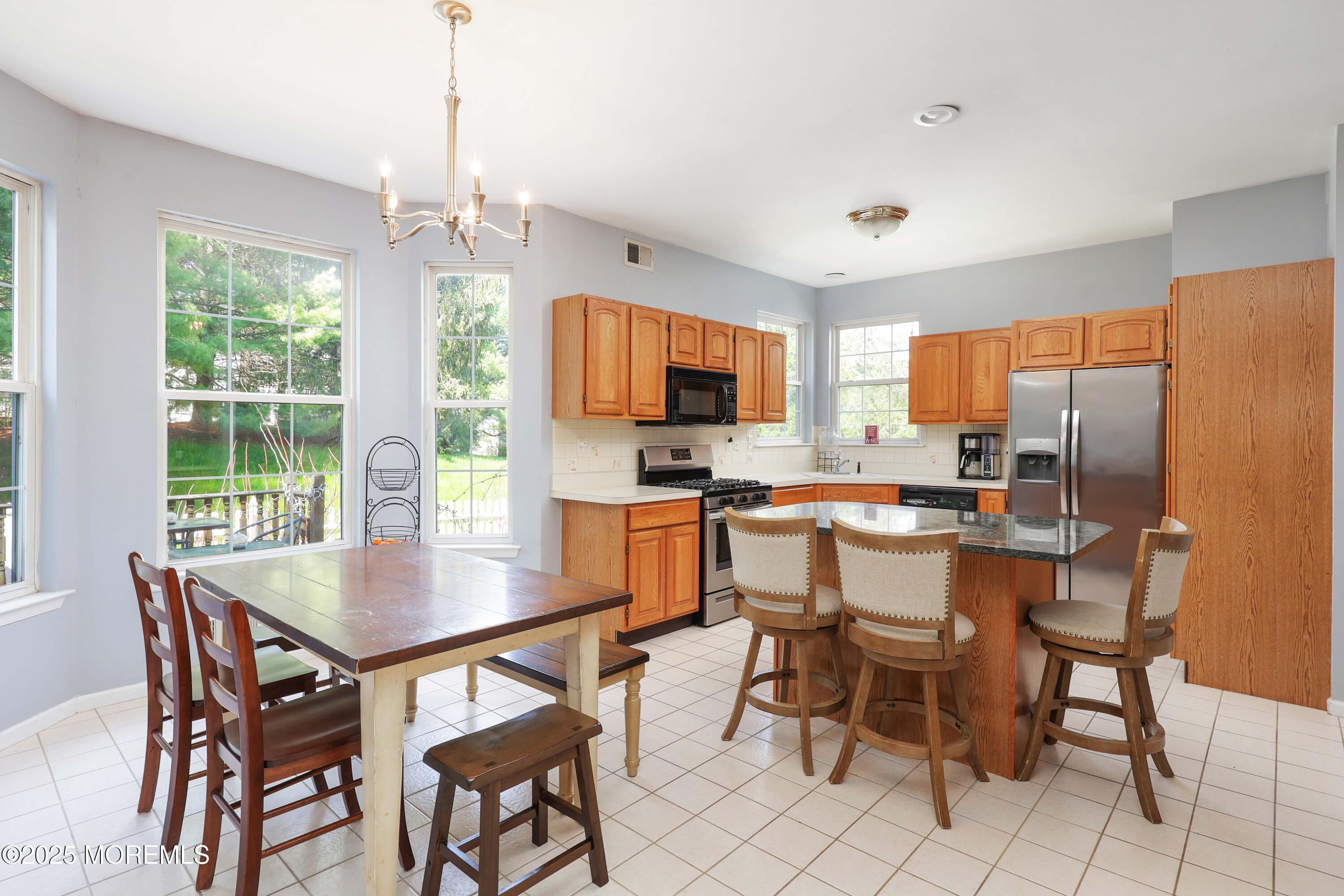1 Exeter Pass Colts Neck, NJ 07722 - Photo 3 of 42 a view of a dining room with furniture window and outside view