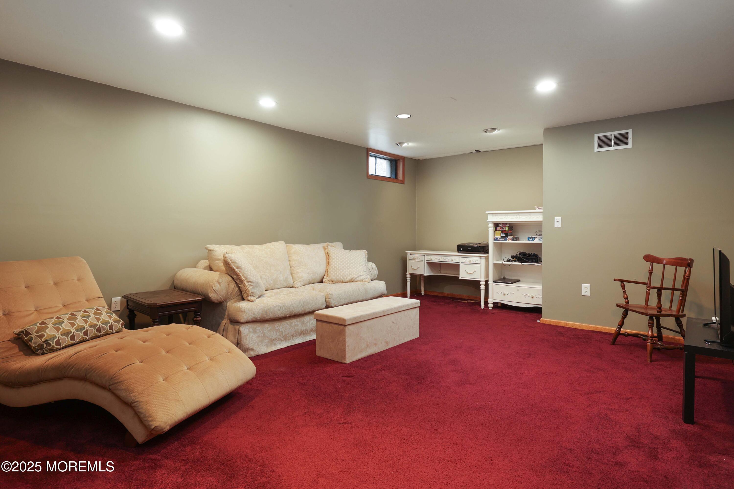1 Exeter Pass Colts Neck, NJ 07722 - Photo 31 of 42 a living room with furniture and a couch