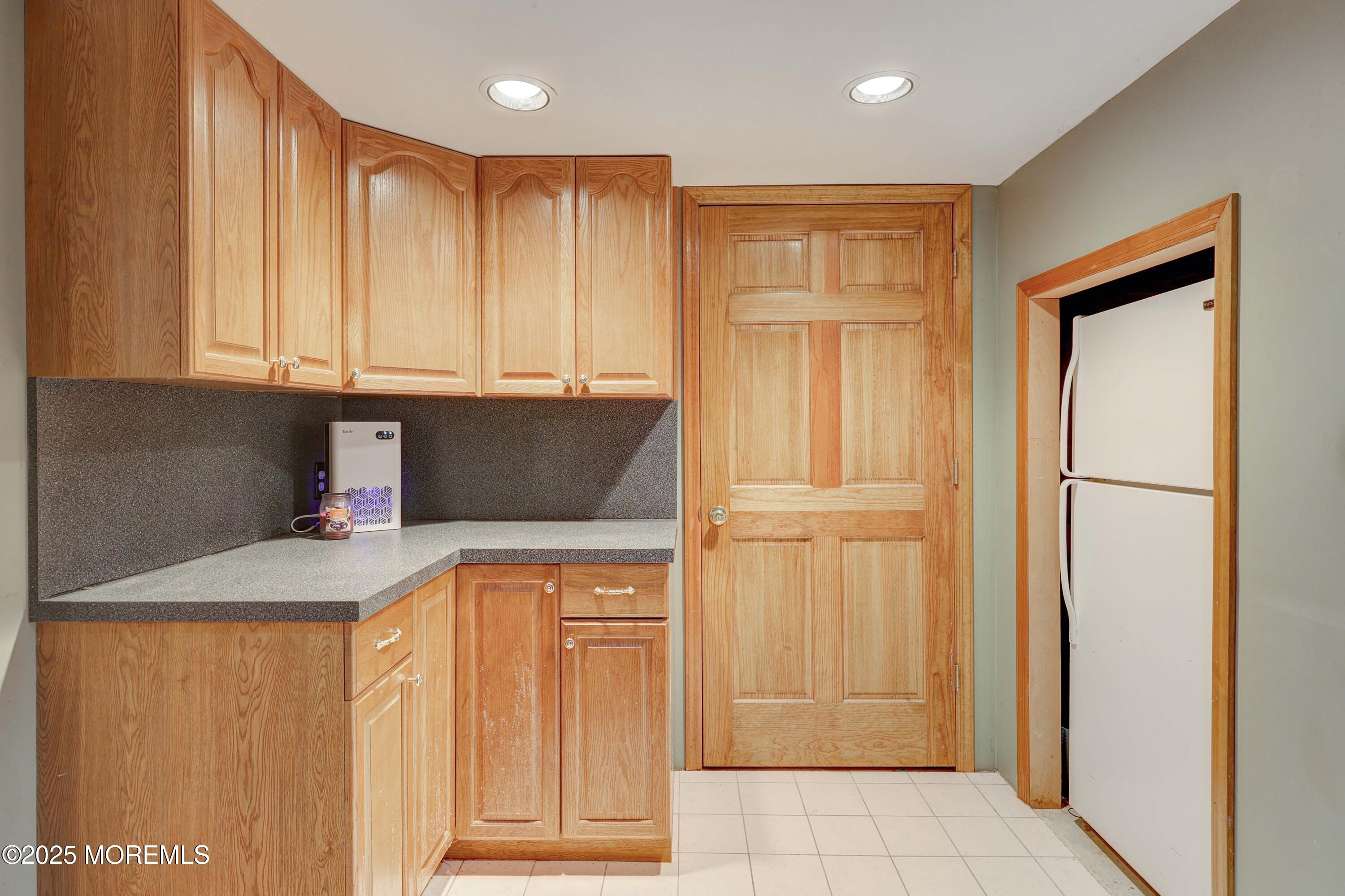 1 Exeter Pass Colts Neck, NJ 07722 - Photo 32 of 42 a kitchen with stainless steel appliances granite countertop a refrigerator and a stove top oven