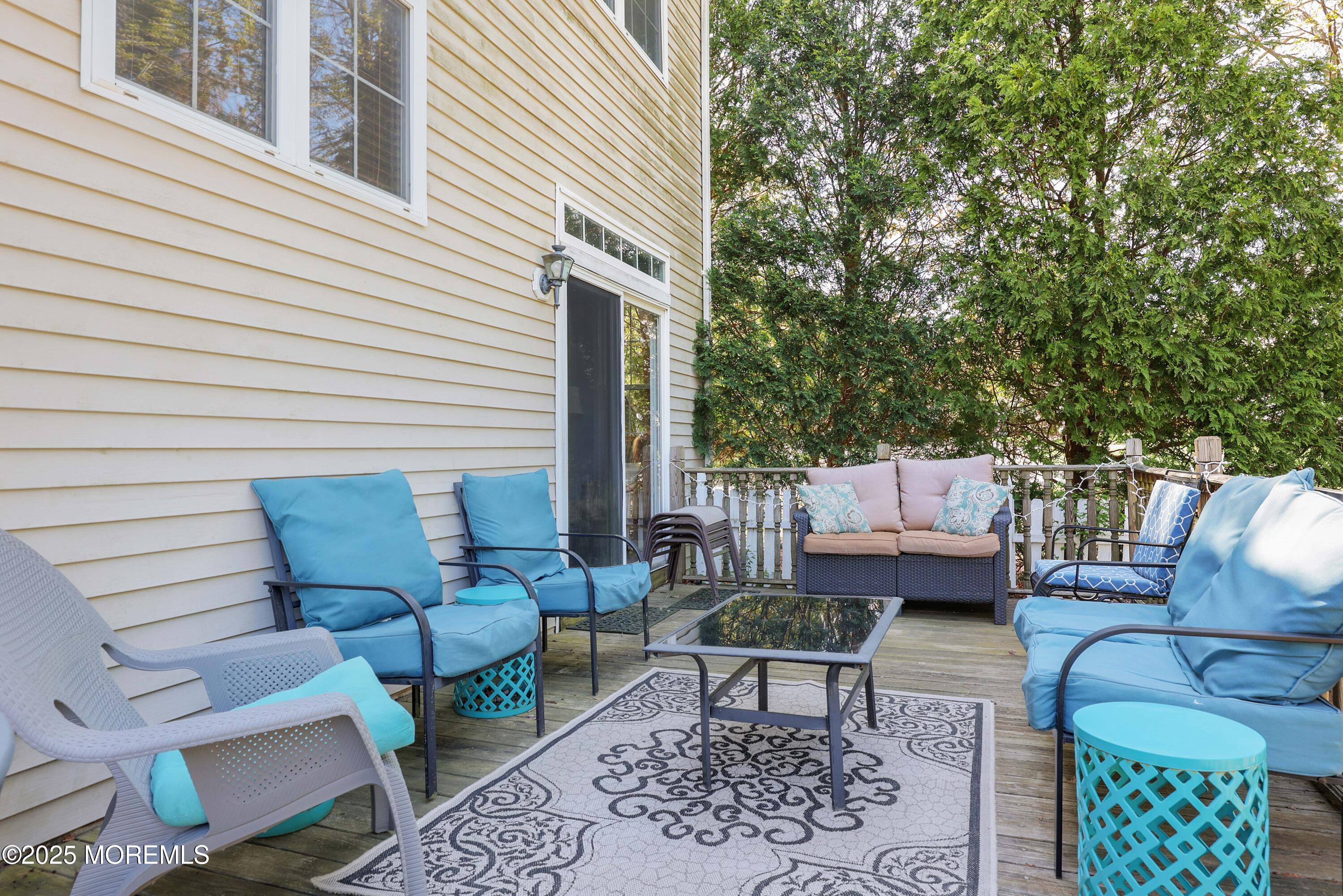 1 Exeter Pass Colts Neck, NJ 07722 - Photo 37 of 42 a roof deck with a couch and chairs