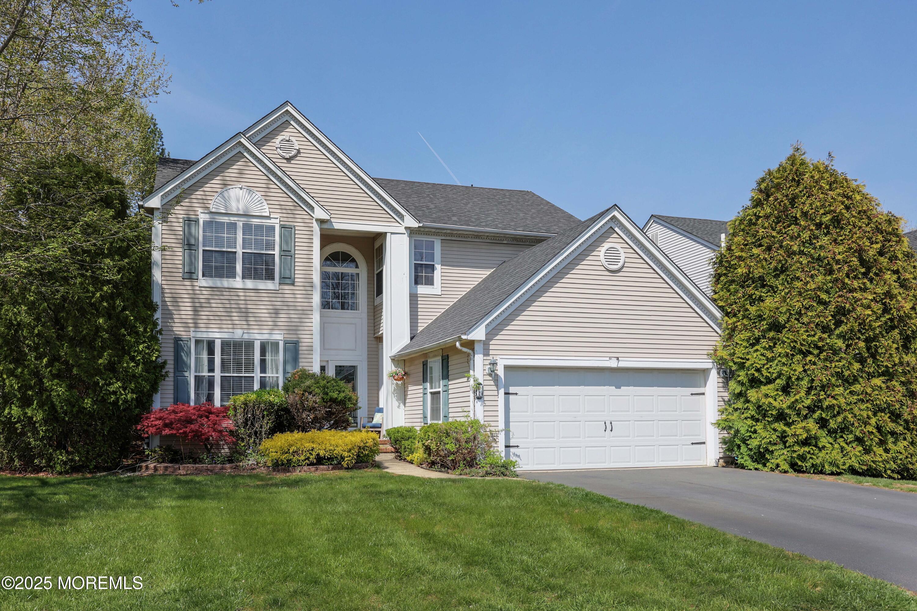 1 Exeter Pass Colts Neck, NJ 07722 - Photo 39 of 42 a front view of a house with a garden