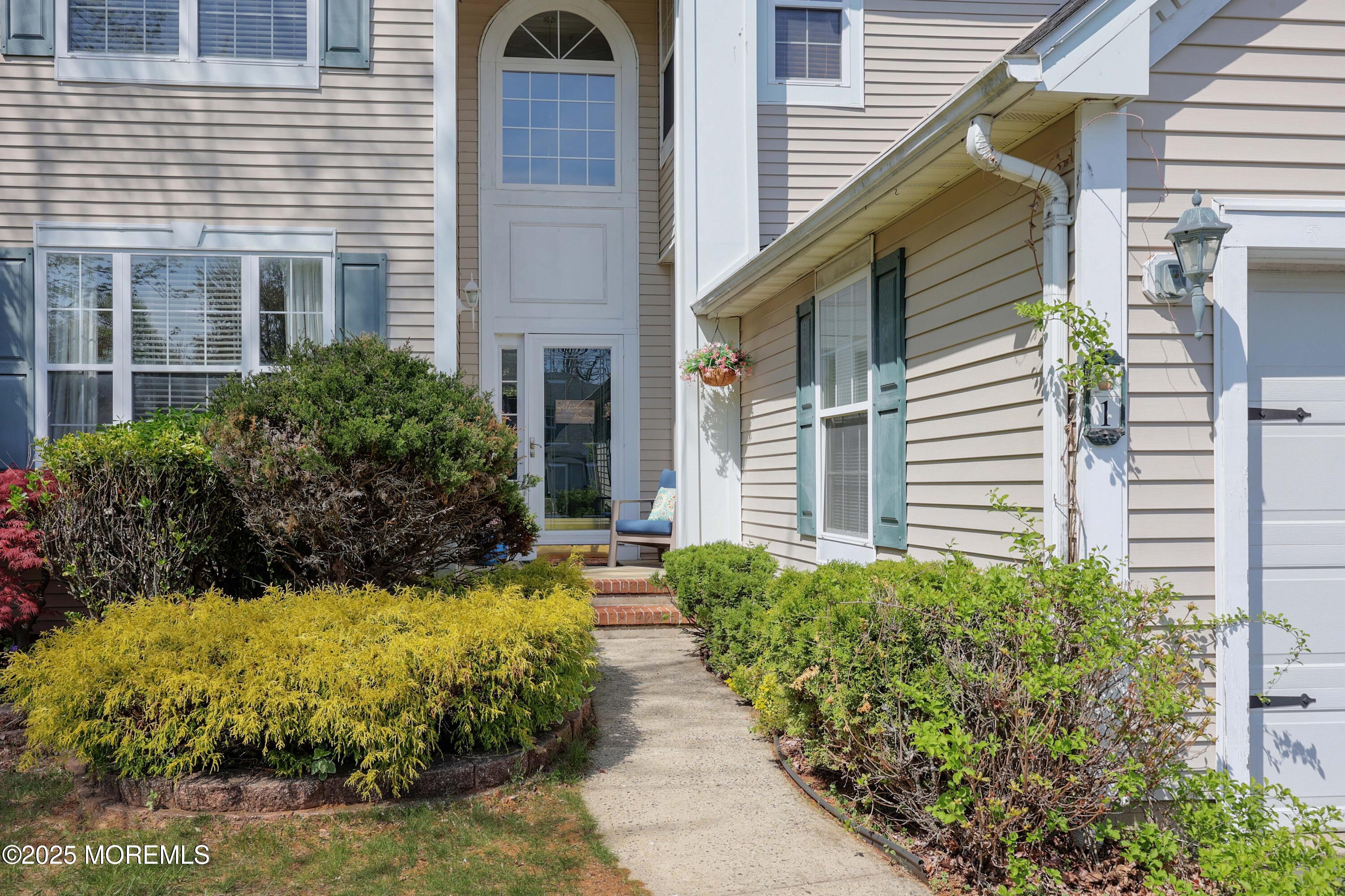 1 Exeter Pass Colts Neck, NJ 07722 - Photo 7 of 42 a view of house with backyard and garden