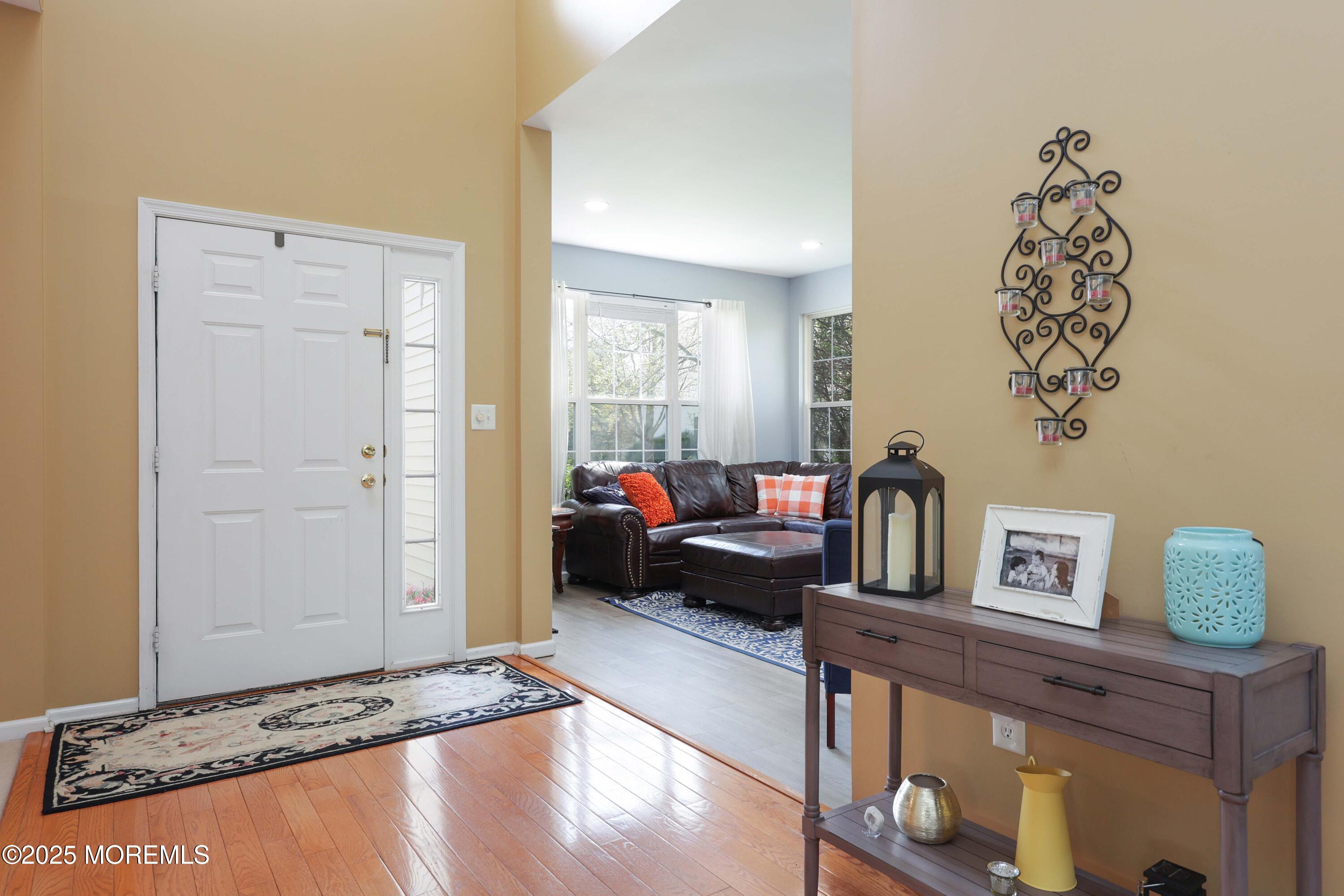 1 Exeter Pass Colts Neck, NJ 07722 - Photo 9 of 42 a living room with furniture and a window