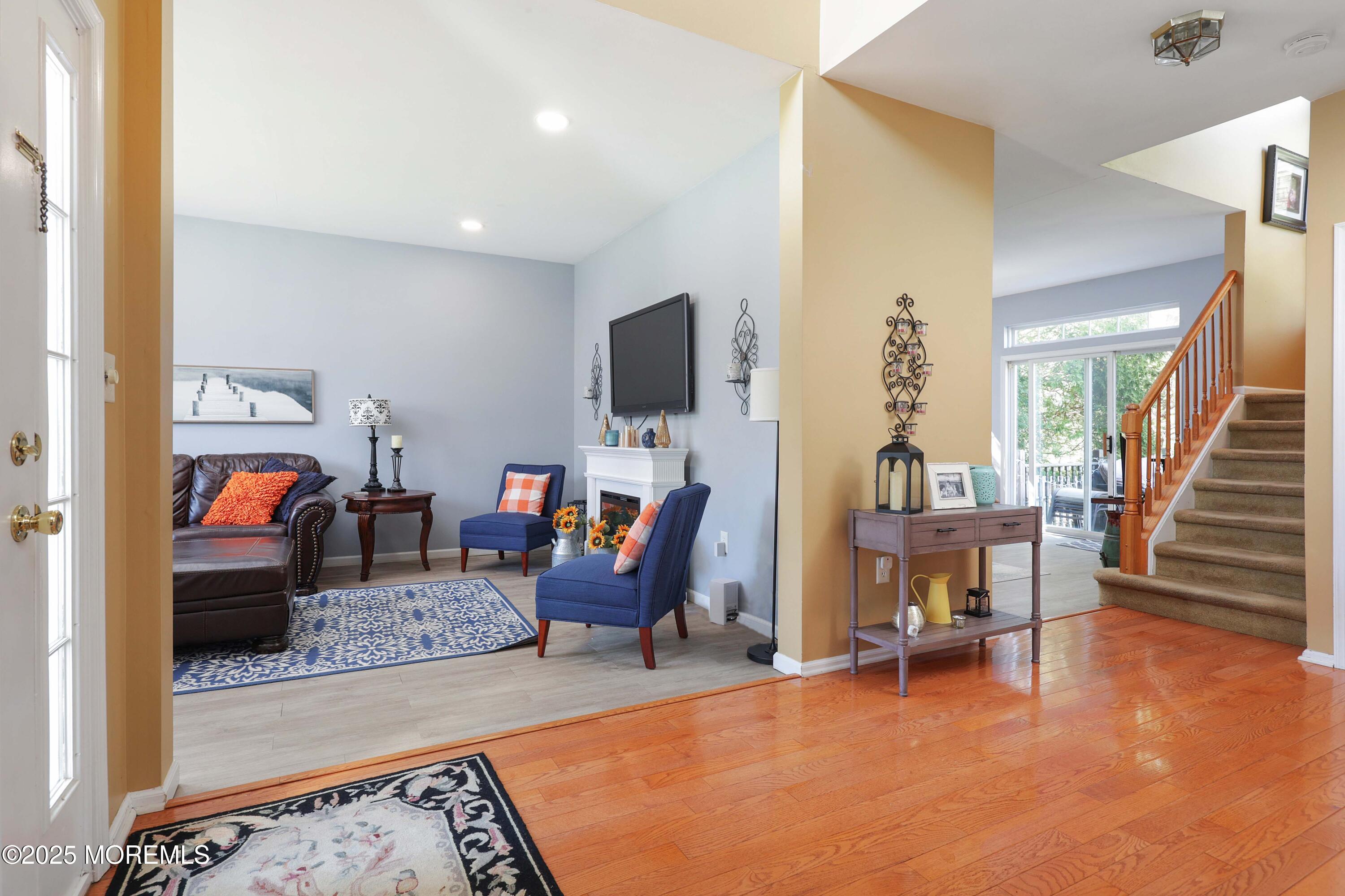 1 Exeter Pass Colts Neck, NJ 07722 - Photo 10 of 42 a living room with furniture and a flat screen tv