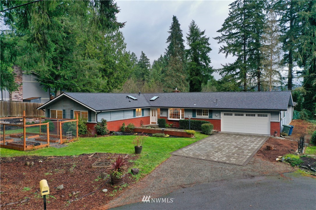 14902 175th Avenue Southeast Renton, WA 98059 - Photo 1 of 39 a front view of a house with garden