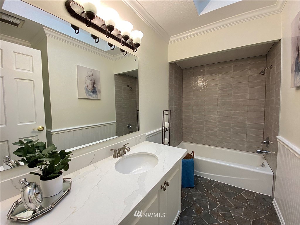 14902 175th Avenue Southeast Renton, WA 98059 - Photo 15 of 39 a bathroom with a tub sink and mirror