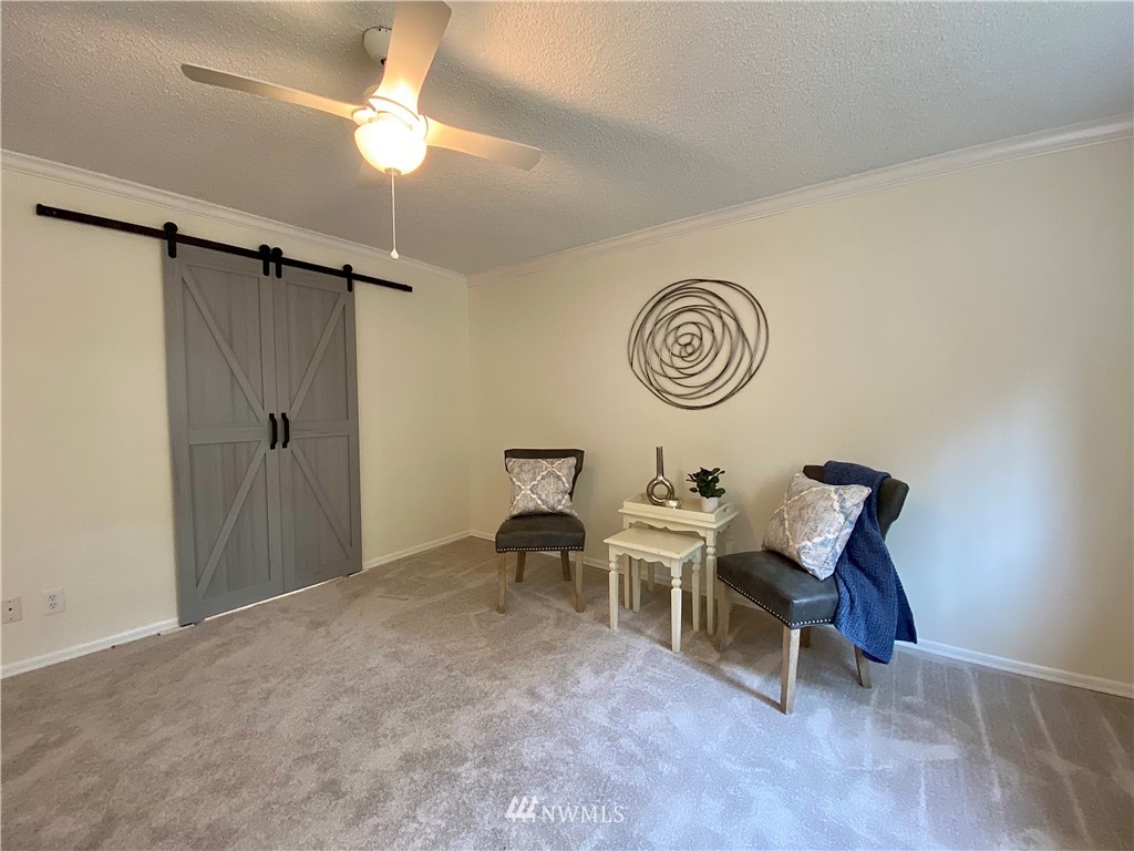 14902 175th Avenue Southeast Renton, WA 98059 - Photo 19 of 39 a view of a room with chairs and closet