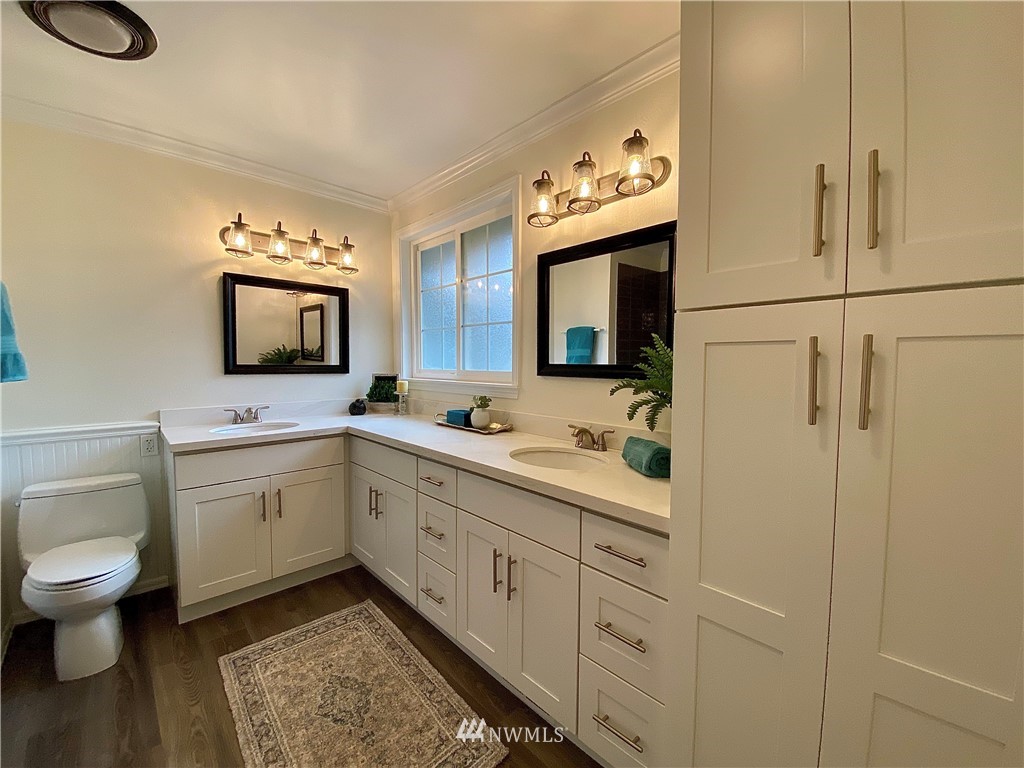 14902 175th Avenue Southeast Renton, WA 98059 - Photo 21 of 39 a spacious bathroom with a toilet sink and mirror