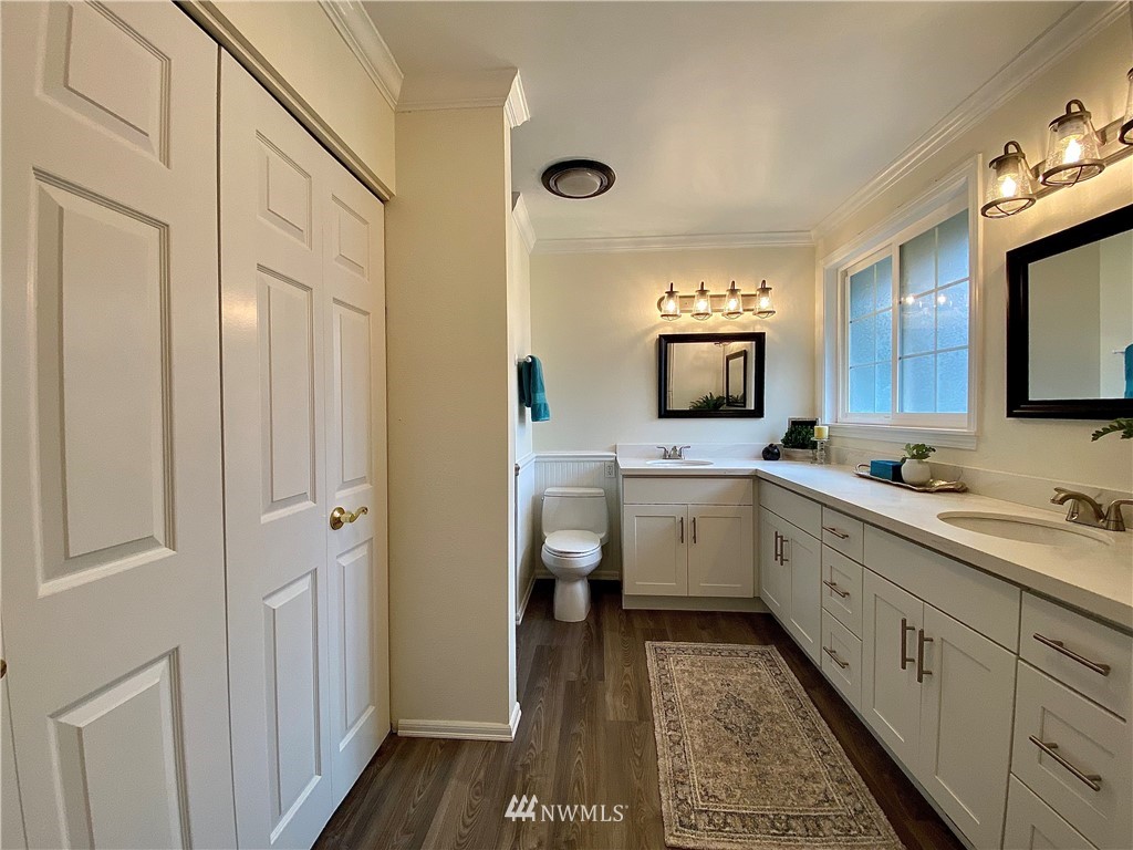 14902 175th Avenue Southeast Renton, WA 98059 - Photo 23 of 39 a bathroom with a sink a toilet and mirror