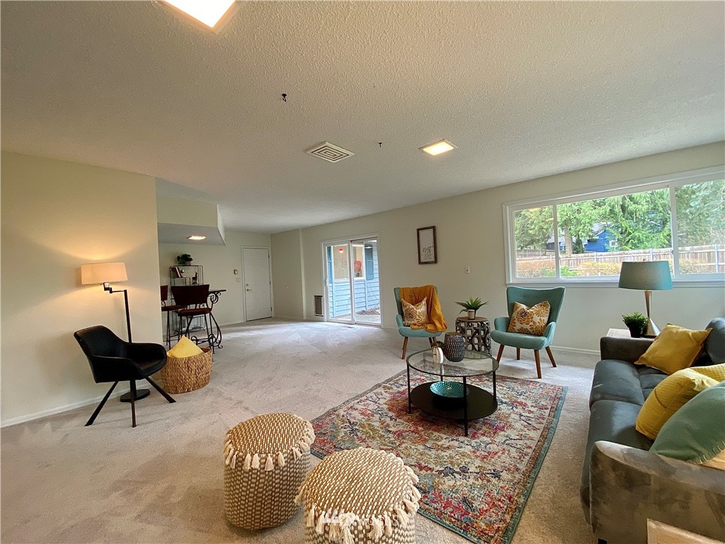 14902 175th Avenue Southeast Renton, WA 98059 - Photo 27 of 39 a living room with furniture and a large window